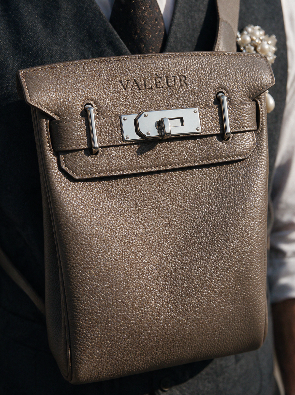 The Sling in Étoupe, the stamp and lock up close